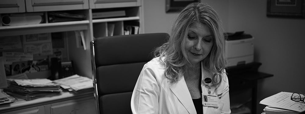 Female doctor sitting at her desk